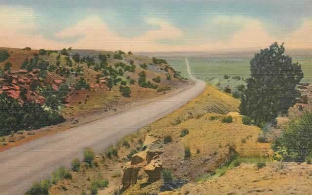 Early scene of rural U.S. Route 66 between Tucumcari and Santa Rosa, New Mexico